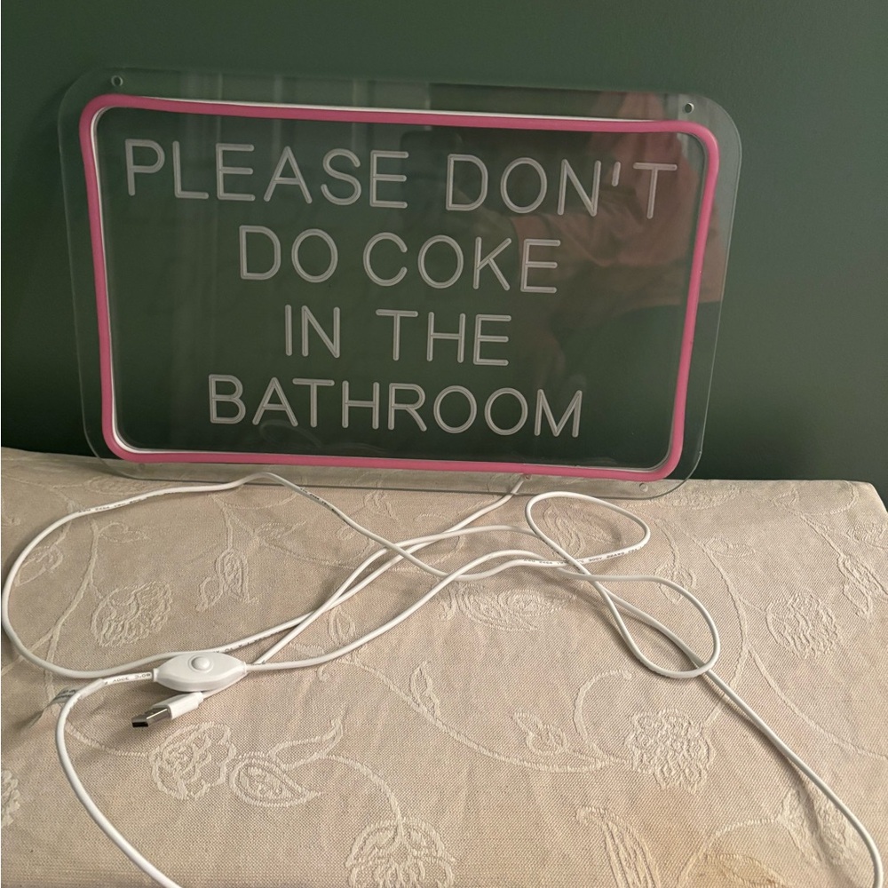 Pink and White Bathroom Sign